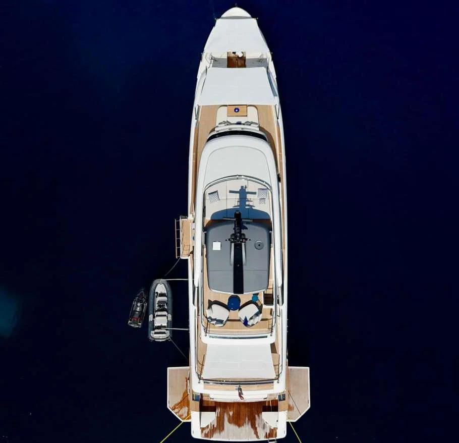 AV1 photographed from directly above, bow at the top, tender and jet ski alongside