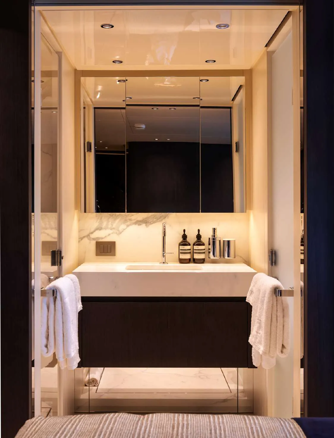 Bathroom with a lit vanity and mirror